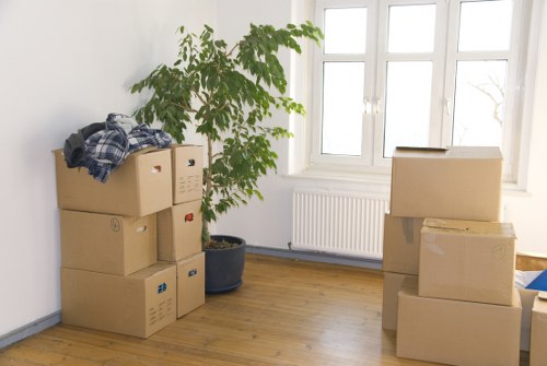 Local moving team handling boxes and furniture in Greenwich
