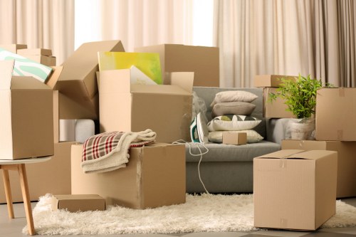Professional movers handling furniture and boxes during a Greenwich home move